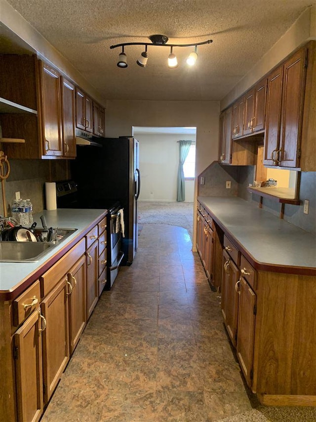 kitchen featuring decorative backsplash, stainless steel electric range oven, under cabinet range hood, open shelves, and a sink