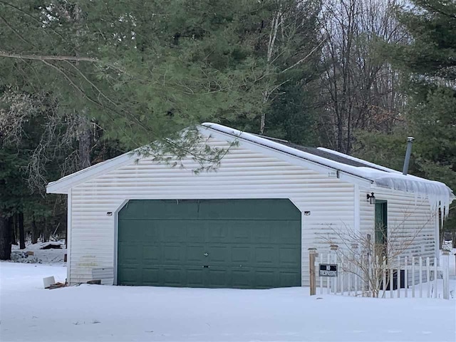 view of snow covered garage