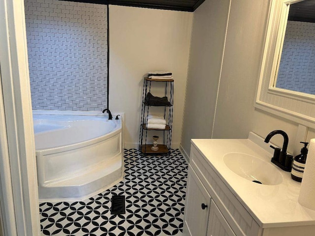 full bathroom with a garden tub and vanity