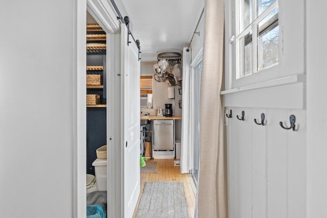 interior space featuring a barn door and light wood-style flooring