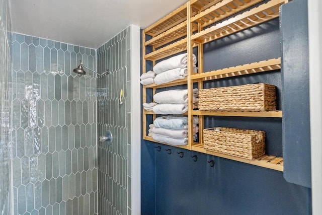 bathroom with tiled shower