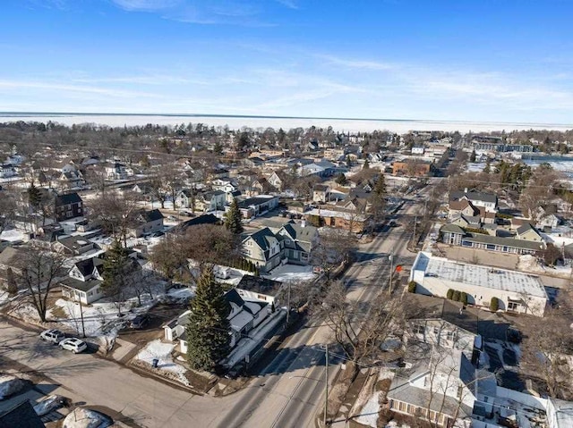 drone / aerial view with a residential view and a water view