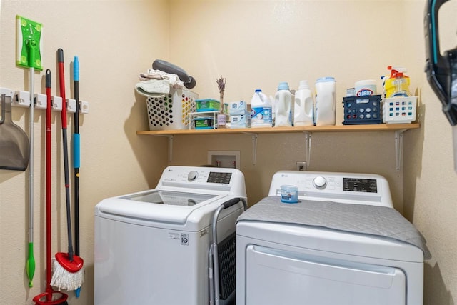 laundry room featuring washer and dryer and laundry area