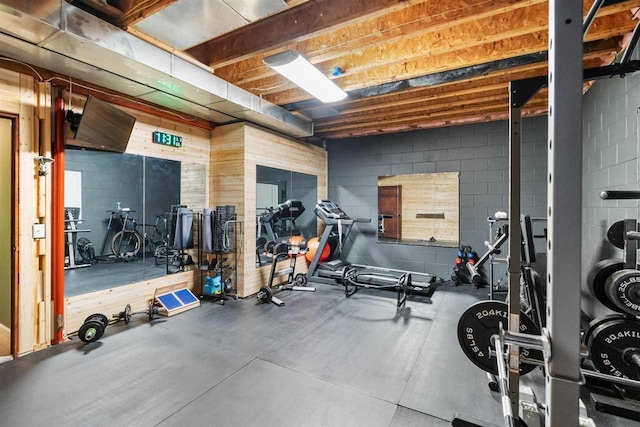 exercise room with concrete block wall