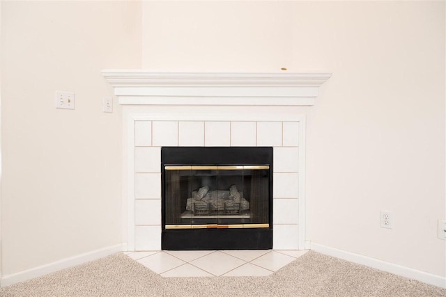 room details with carpet floors, a tiled fireplace, and baseboards