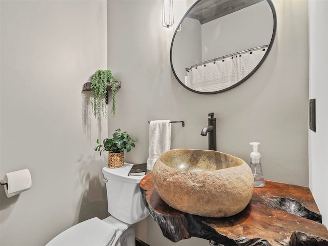 bathroom with a sink and toilet