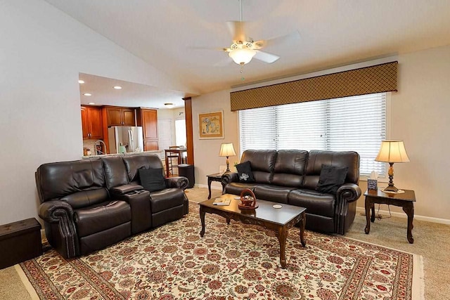 carpeted living area with a ceiling fan, lofted ceiling, baseboards, and recessed lighting