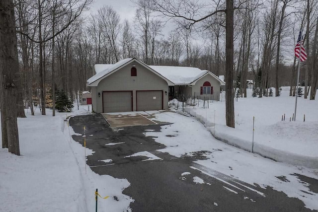 view of front of home featuring a garage and driveway