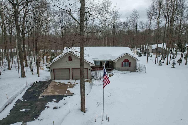 view of front of house with a garage and an outdoor structure