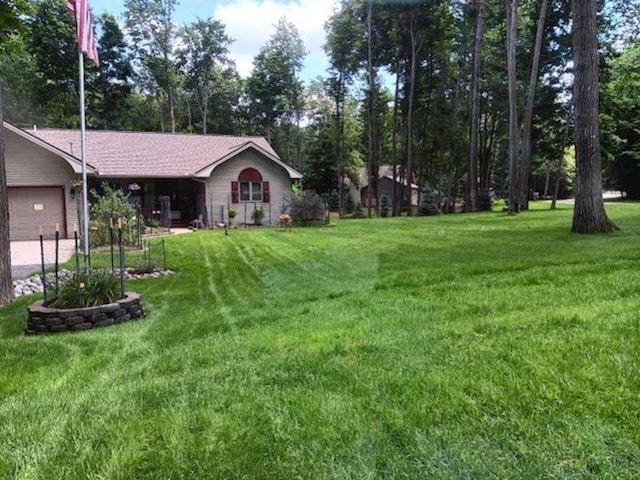 view of yard with an attached garage