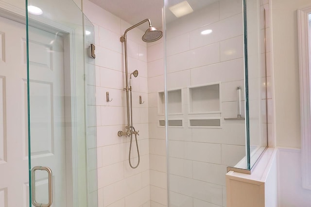 bathroom featuring a shower stall