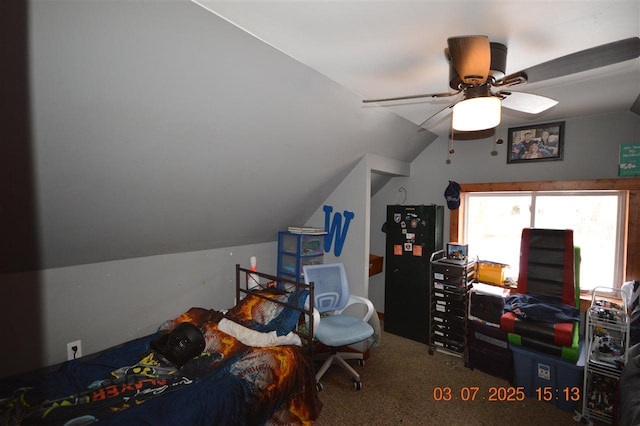 bedroom featuring ceiling fan, carpet, and vaulted ceiling