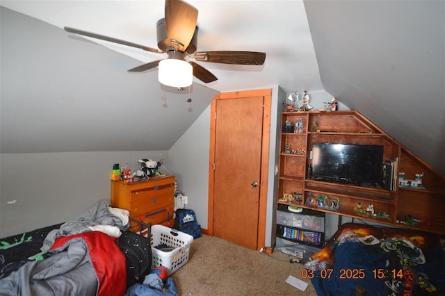 bedroom featuring lofted ceiling, carpet floors, and a ceiling fan