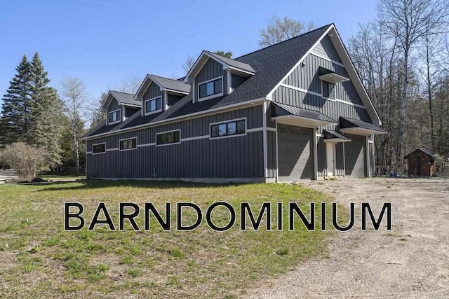 view of side of home featuring a garage and board and batten siding