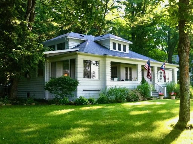 bungalow-style home featuring a front yard