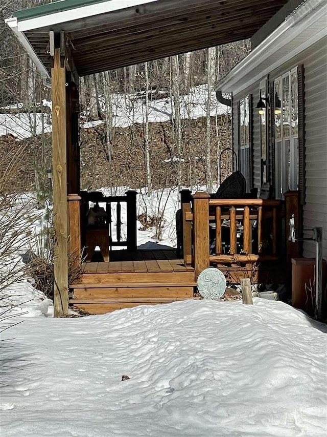 view of snow covered deck