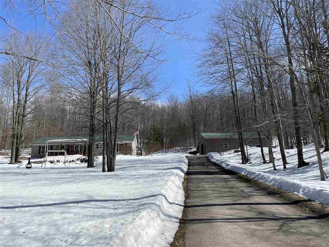 view of street featuring a wooded view