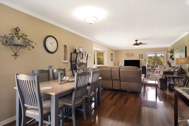 dining area with baseboards, ceiling fan, dark wood-style flooring, and crown molding