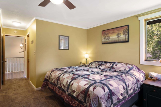 bedroom featuring crown molding, a ceiling fan, baseboards, and carpet floors