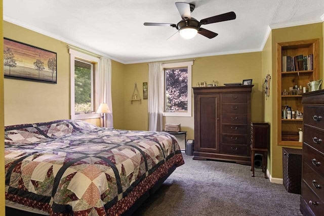 carpeted bedroom with a ceiling fan, baseboards, and ornamental molding