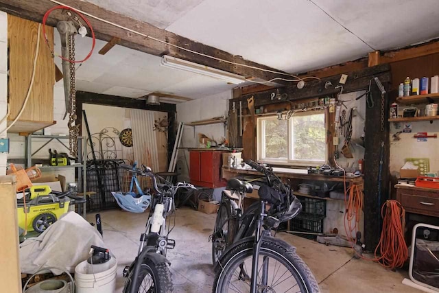 misc room featuring a workshop area and concrete flooring