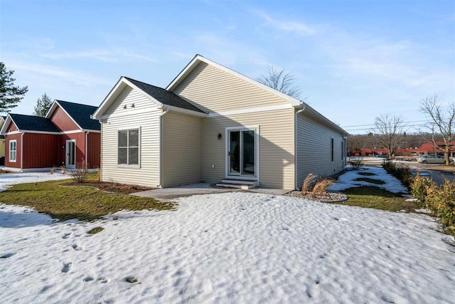 rear view of property with entry steps