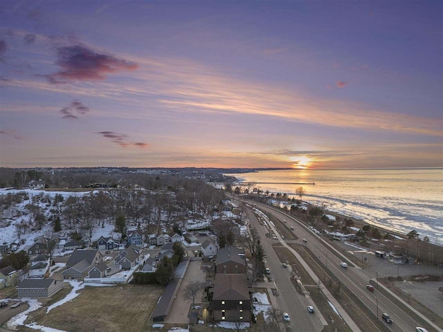 drone / aerial view featuring a residential view and a water view