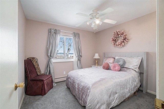 carpeted bedroom with a baseboard radiator, baseboards, and a ceiling fan