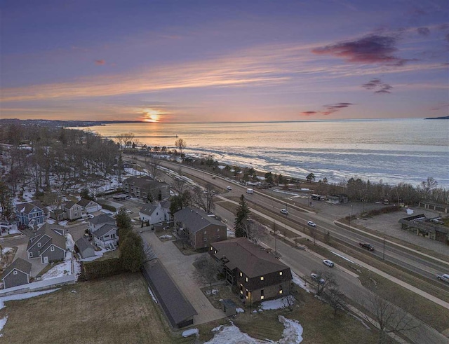 aerial view at dusk with a water view