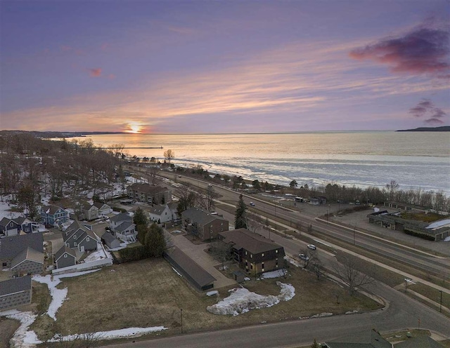 birds eye view of property featuring a view of the beach and a water view