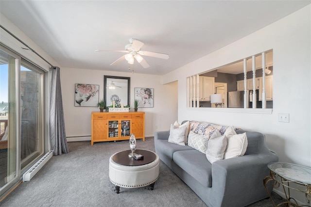 carpeted living room with ceiling fan, baseboards, baseboard heating, and a baseboard radiator