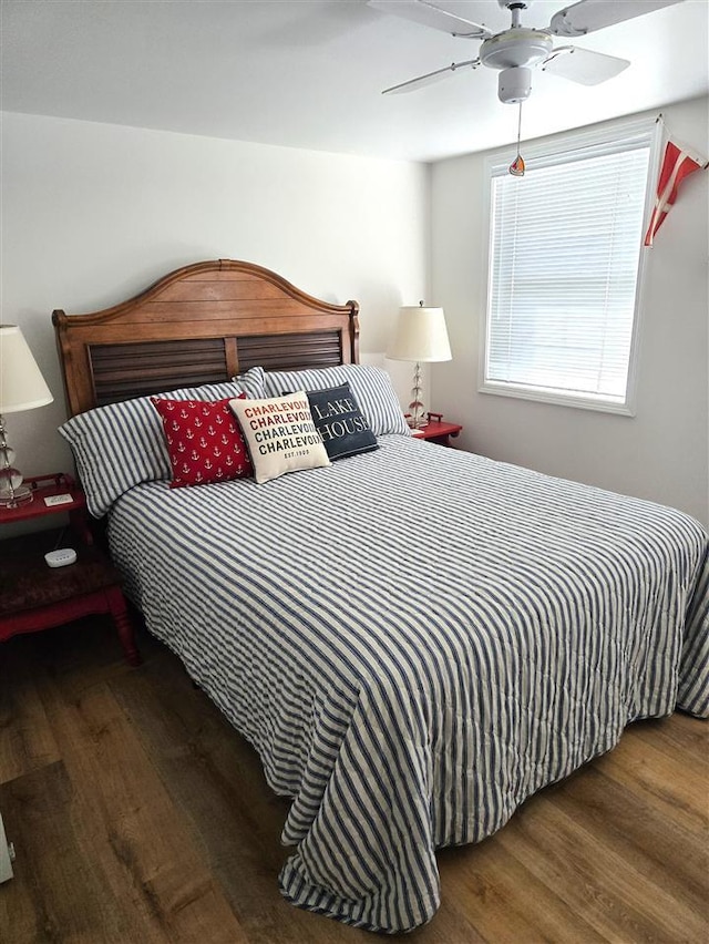 bedroom with a ceiling fan and wood finished floors