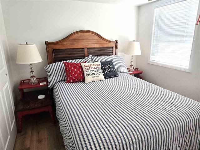 bedroom with wood finished floors