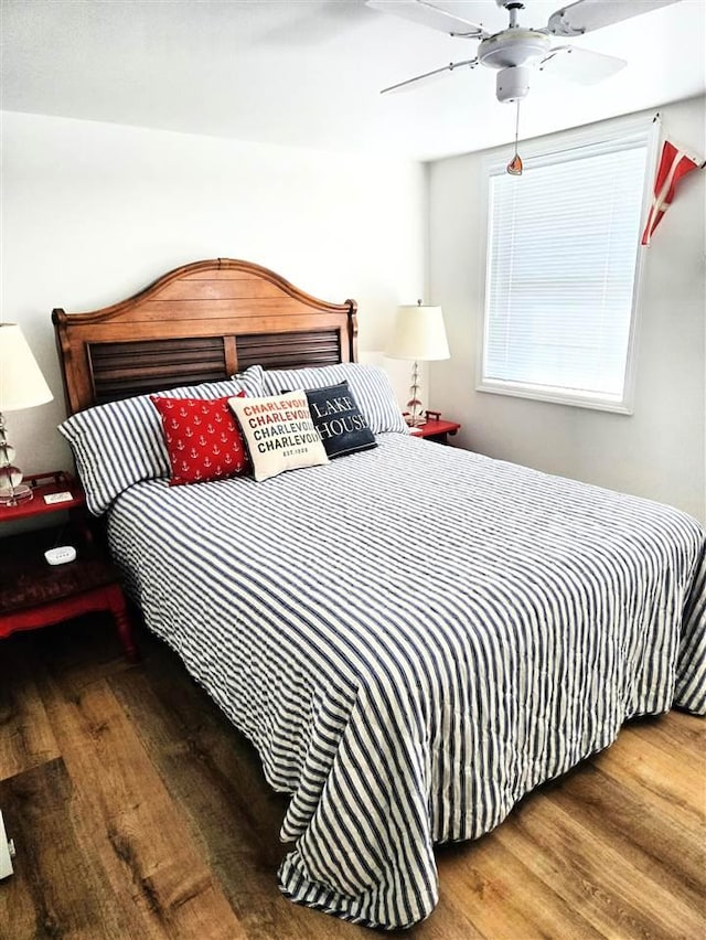 bedroom with a ceiling fan and wood finished floors