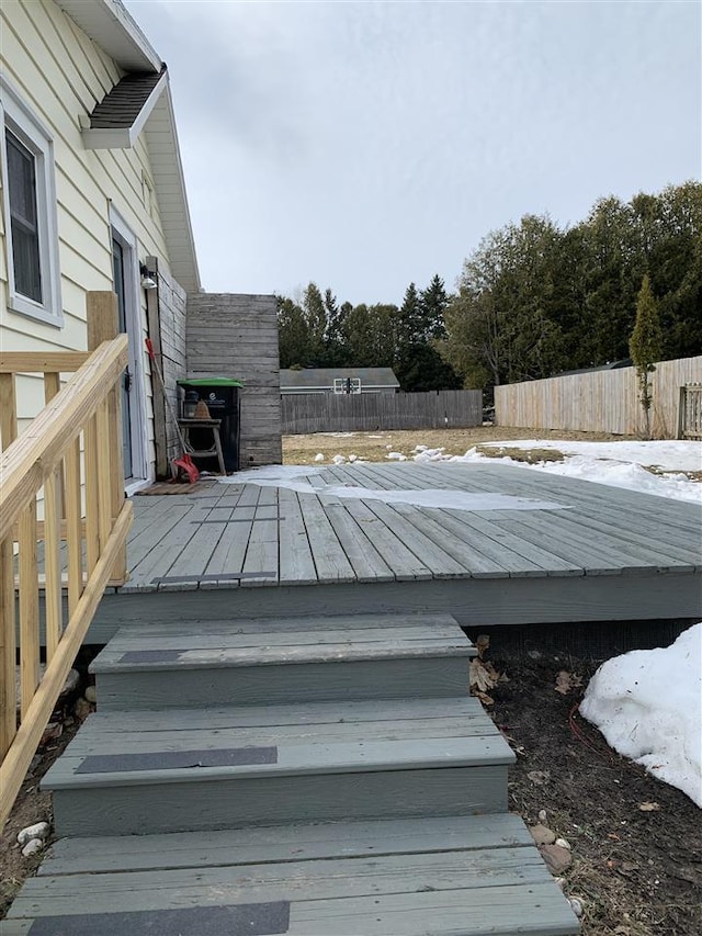 wooden terrace featuring fence