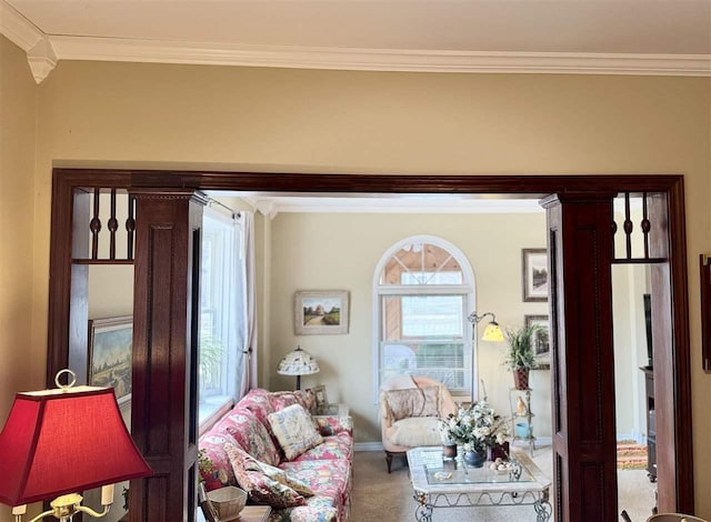 carpeted living area with crown molding