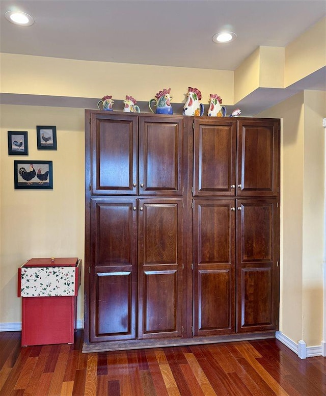 room details featuring recessed lighting, baseboards, and wood finished floors