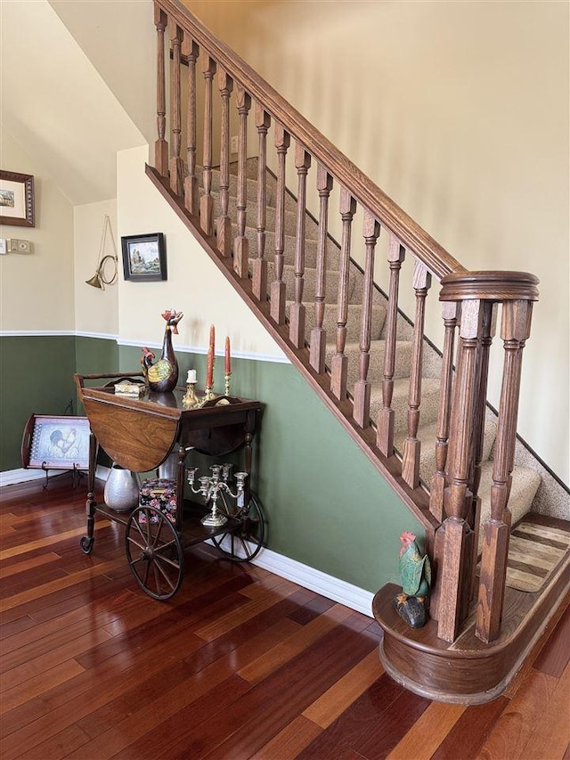 staircase featuring hardwood / wood-style flooring