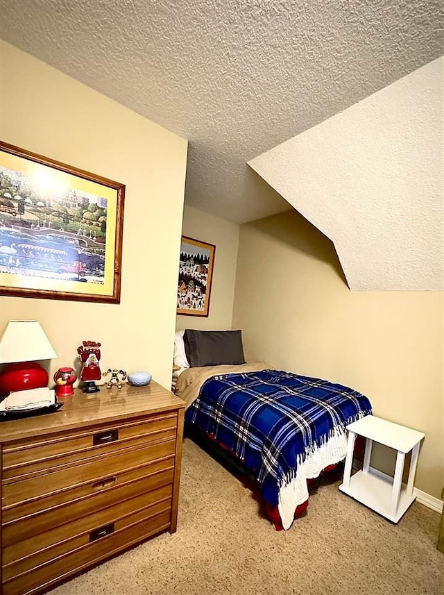 carpeted bedroom with a textured ceiling