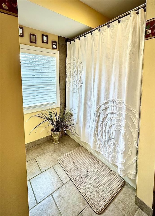 bathroom with baseboards