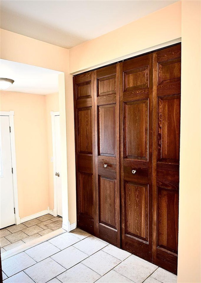 interior space featuring baseboards