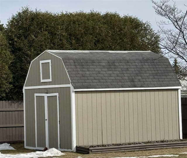 view of shed with fence