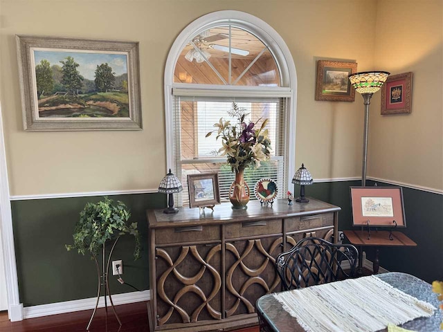 details with baseboards and a ceiling fan