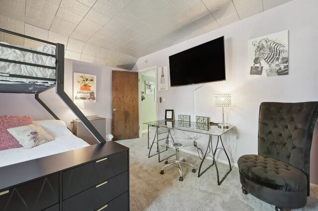 bedroom featuring light carpet