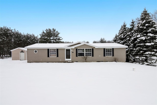7116 S M-88 Hwy, Bellaire, MI 49615 - view of front of home featuring a shed and an outdoor structure