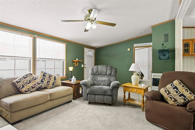 7116 S M-88 Hwy, Bellaire, MI 49615 - carpeted living room with lofted ceiling, ornamental molding, a textured ceiling, ceiling fan, and heating unit