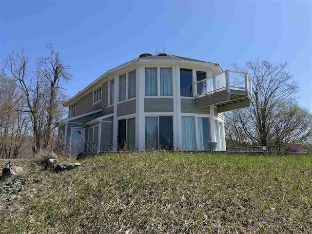 1323 Charlevoix St, Boyne City, MI 49712 - rear view of property with a balcony