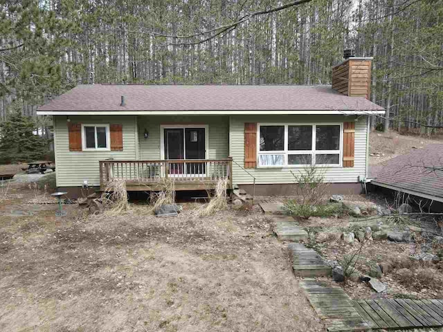 2382 Pleasant Valley Rd, Boyne City, MI 49712 - single story home featuring roof with shingles and a chimney
