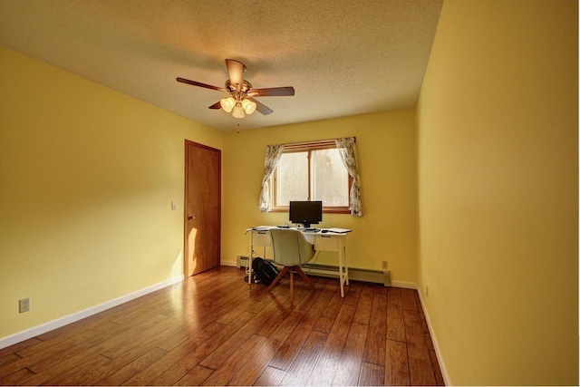 2382 Pleasant Valley Rd, Boyne City, MI 49712 - home office featuring ceiling fan, a textured ceiling, hardwood / wood-style floors, a baseboard radiator, and baseboards