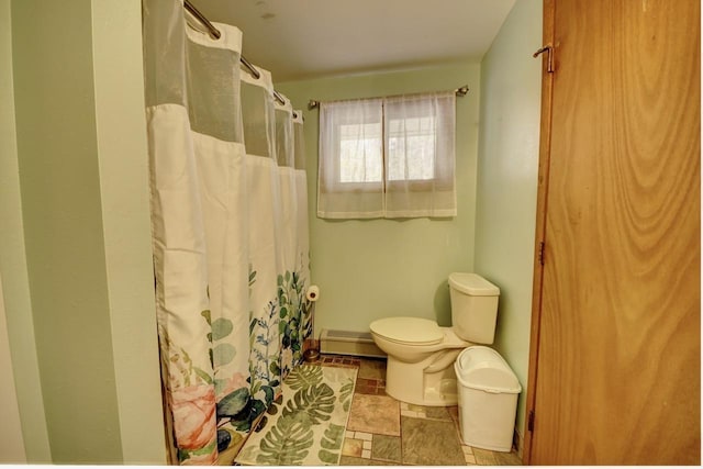 2382 Pleasant Valley Rd, Boyne City, MI 49712 - full bathroom with a shower with shower curtain, a baseboard heating unit, and toilet